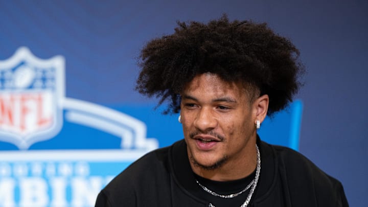 Washington wideout Denzel Boston speaks to members of the media