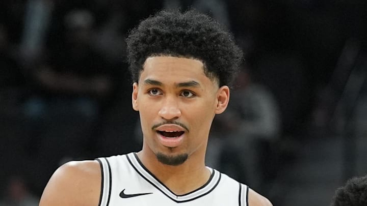 Jan 19, 2026; San Antonio, Texas, USA; San Antonio Spurs guard Dylan Harper (2) looks on with Utah Jazz guard Ace Bailey (19) during the second half at Frost Bank Center. Mandatory Credit: Daniel Dunn-Imagn Images