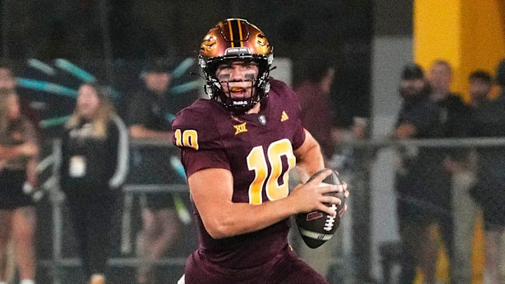 Arizona State Sun Devils quarterback Sam Leavitt (10) is chased by Utah Utes safety Alaka'i Gilman (11) and defensive tackle Dallas Vakalahi (98) in the first half at Mountain America Stadium.