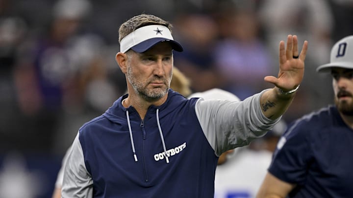 Aug 16, 2025; Arlington, Texas, USA; Dallas Cowboys head coach Brian Schottenheimer looks on before the game against the Baltimore Ravens at AT&T Stadium. 