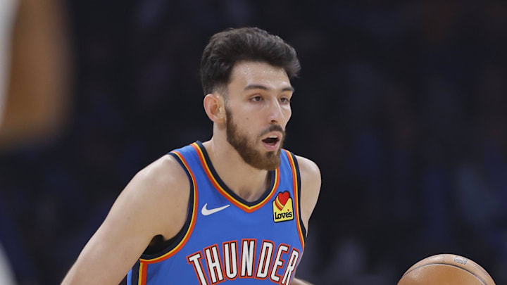 Dec 18, 2025; Oklahoma City, Oklahoma, USA; Oklahoma City Thunder center Chet Holmgren (7) dribbles down the court against the Los Angeles Clippers during the first quarter at Paycom Center. Mandatory Credit: Alonzo Adams-Imagn Images