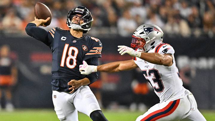 Quarterback Caleb Williams gets a throw off against New England with Patriots linebacker Christian Elliss pressuring. Quarterback Caleb Williams gets a throw off against New England with Patriots linebacker Christian Elliss pressuring.