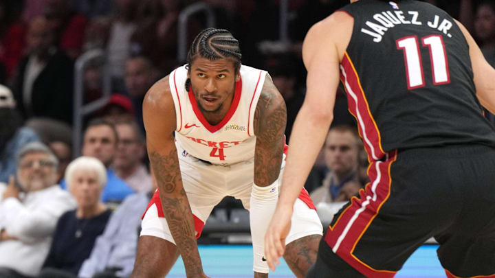 Mar 21, 2025; Miami, Florida, USA;  Houston Rockets guard Jalen Green (4) looks to pass the ball as Miami Heat guard Jaime Jaquez Jr. (11) closes in during the first half at Kaseya Center. Mandatory Credit: Jim Rassol-Imagn Images