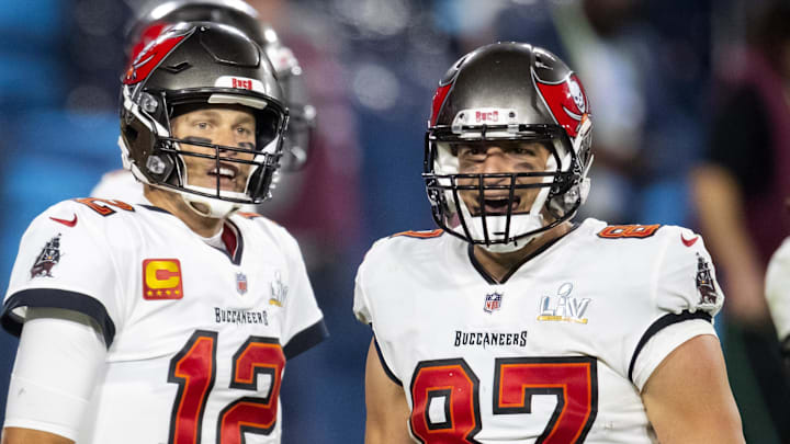 Feb 4, 2020; Tampa, FL, USA;  Tampa Bay Buccaneers running back Leonard Fournette (28) with quarterback Tom Brady (12) and tight end Rob Gronkowski (87) against the Kansas City Chiefs in Super Bowl LV at Raymond James Stadium.  Mandatory Credit: Mark J. Rebilas-Imagn Images