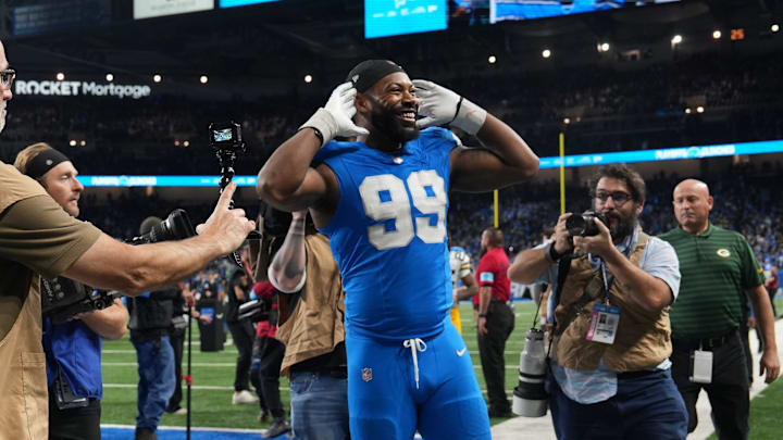 Detroit Lions defensive end Za'Darius Smith (99) looks to the fans after defeating Green Bay Packers