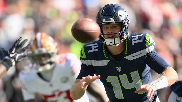 Oct 11, 2026; Seattle, Washington, USA; Seattle Seahawks quarterback Sam Darnold (14) pitches the ball to running back Emanuel Wilson (23) against the San Francisco 49ers during the first half at Lumen Field. Oct 11, 2026; Seattle, Washington, USA; Seattle Seahawks quarterback Sam Darnold (14) pitches the ball to running back Emanuel Wilson (23) against the San Francisco 49ers during the first half at Lumen Field.