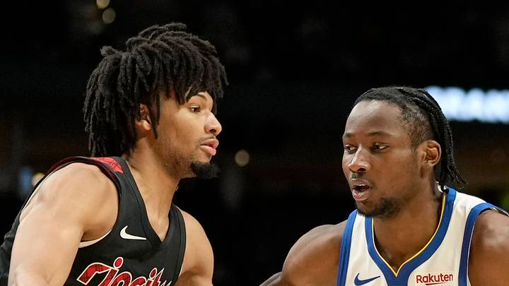 Golden State Warriors forward Jonathan Kuminga dribbles the ball as Portland Trail Blazers guard Shaedon Sharpe defends Golden State Warriors forward Jonathan Kuminga dribbles the ball as Portland Trail Blazers guard Shaedon Sharpe defends