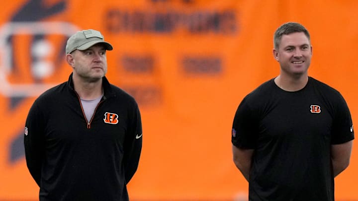 From left: Director of College Scouting Mike Potts, Director of Player Personnel Duke Tobin, head coach Zac Taylor and defensive coordinator Lou Anarumo talk as rookies stretch during the team   s mini rookie camp, Friday, May 12, 2023, inside the team   s indoor practice bubble in Cincinnati.
