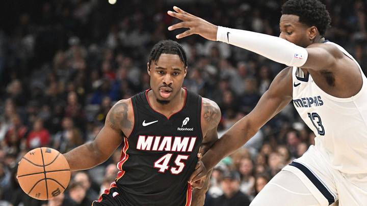 Mar 15, 2025; Memphis, Tennessee, USA; Miami Heat point guard Davion Mitchell (45) drives past defender Memphis Grizzlies power forward Jaren Jackson Jr. (13) in the second quarter of the game against the Memphis Grizzlies at FedExForum. Mandatory Credit: Matthew Smith-Imagn Images Mar 15, 2025; Memphis, Tennessee, USA; Miami Heat point guard Davion Mitchell (45) drives past defender Memphis Grizzlies power forward Jaren Jackson Jr. (13) in the second quarter of the game against the Memphis Grizzlies at FedExForum. Mandatory Credit: Matthew Smith-Imagn Images