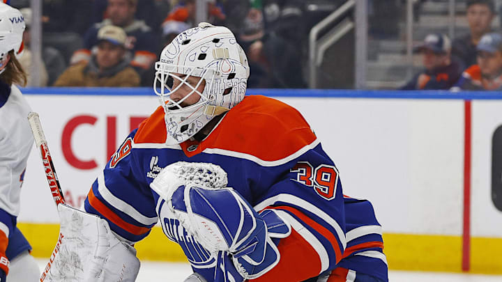 Jan 15, 2026; Edmonton, Alberta, CAN; New York Islanders forward Max Shabanov (49) and Edmonton Oilers defensemen Spencer Stastney (24) battle in front of goaltender Connor Ingram. This goaltender has his first shutout since joining the Edmonton Oilers. (39) during the second period at Rogers Place. Mandatory Credit: Perry Nelson-Imagn Images