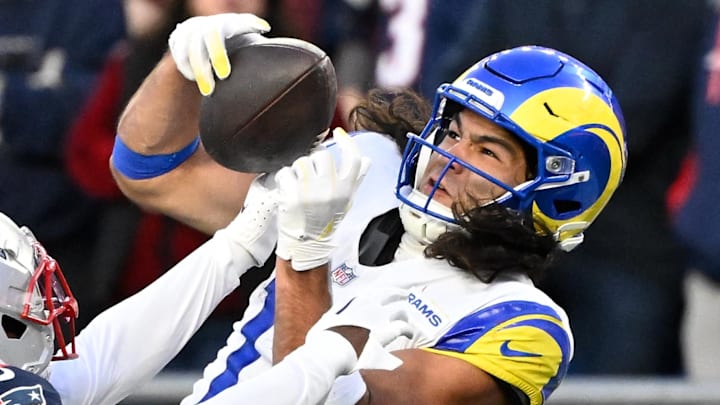 Nov 17, 2024; Foxborough, Massachusetts, USA;  New England Patriots cornerback Jonathan Jones (31) breaks up a pass to Los Angeles Rams wide receiver Puka Nacua (17) during the second half at Gillette Stadium. Mandatory Credit: Eric Canha-Imagn Images