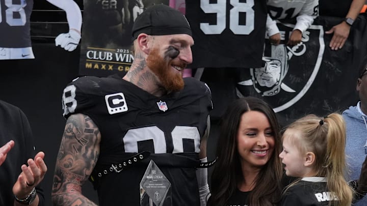 Las Vegas Raiders defensive end Maxx Crosby (98) along with his wife Rachel Washburn and daughter Ella Rose Crosby 