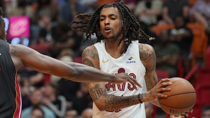 Mar 24, 2024; Miami, Florida, USA;  Cleveland Cavaliers forward Emoni Bates (21) looks to pass the ball as Miami Heat center Thomas Bryant (31) defends during the second half at Kaseya Center. Mandatory Credit: Jim Rassol-Imagn Images