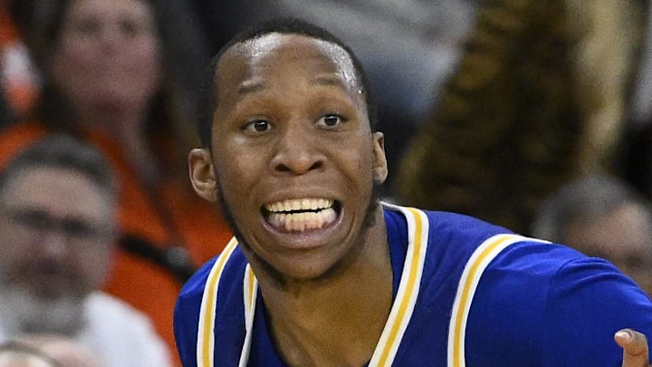 Mar 20, 2025; Providence, RI, USA; McNeese State Cowboys guard Quadir Copeland (11) brings the ball up court against Clemson Tigers guard Chase Hunter (1) during the second half at Amica Mutual Pavilion. Mandatory Credit: Eric Canha-Imagn Images