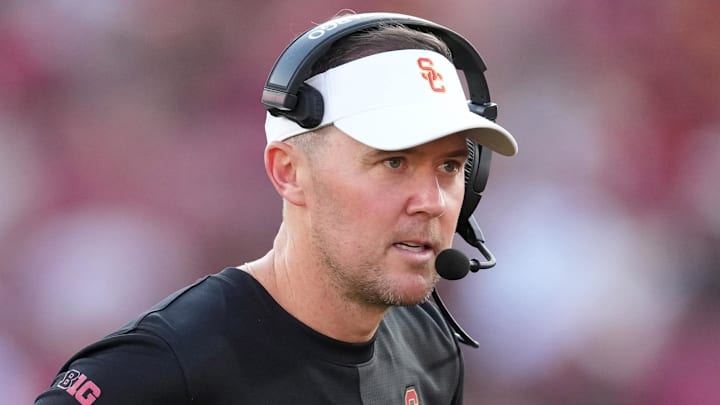 Aug 30, 2025; Los Angeles, California, USA; Southern California Trojans head coach Lincoln Riley talks with Southern California Trojans quarterback Husan Longstreet (4) in the second half against the Missouri State Bears at United Airlines Field at Los Angeles Memorial Coliseum. Mandatory Credit: Kirby Lee-Imagn Images