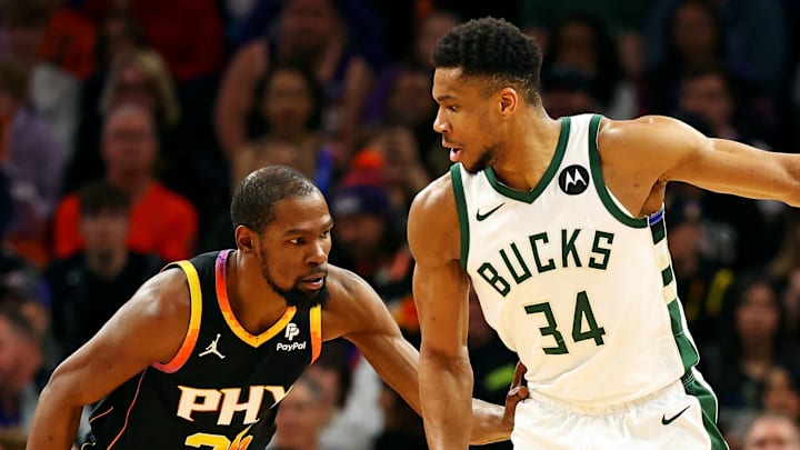 Feb 6, 2024; Phoenix, Arizona, USA; Milwaukee Bucks forward Giannis Antetokounmpo (34) handles the ball against the Phoenix Suns forward Kevin Durant (35) during the third quarter at Footprint Center. Mandatory Credit: Mark J. Rebilas-Imagn Images