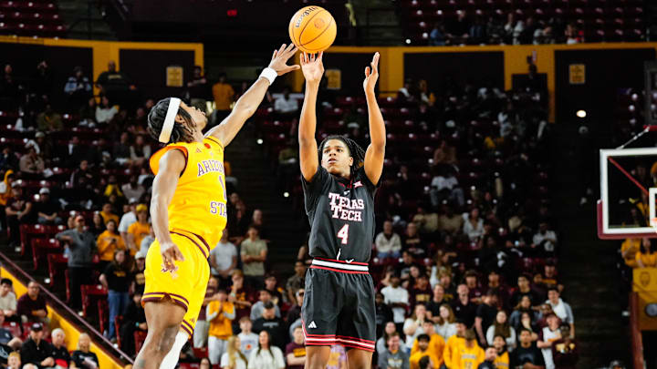Mar 8, 2025; Tempe, Arizona, USA; Texas Tech Red Raiders guard Christian Anderson (4) shoots against Arizona State Sun Devils guard Alston Mason (1) during the first half at Desert Financial Arena. Mandatory Credit: Arianna Grainey-Imagn Images