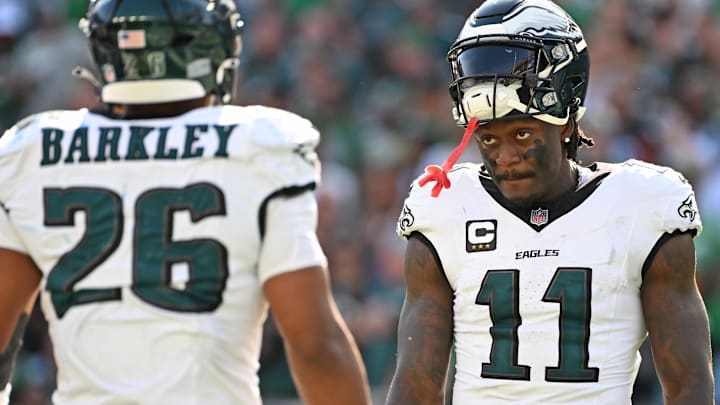 Philadelphia Eagles wide receiver AJ. Brown (11) and running back Saquon Barkley (26) during the fourth quarter against the Los Angeles Rams at Lincoln Financial Field.