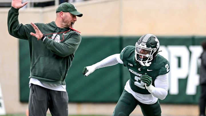 Michigan State's Khris Bogle, right, runs a drill with rush ends coach Chad Wilt during the Spring Showcase on Saturday, April 20, 2024, at Spartan Stadium in East Lansing. Michigan State's Khris Bogle, right, runs a drill with rush ends coach Chad Wilt during the Spring Showcase on Saturday, April 20, 2024, at Spartan Stadium in East Lansing.