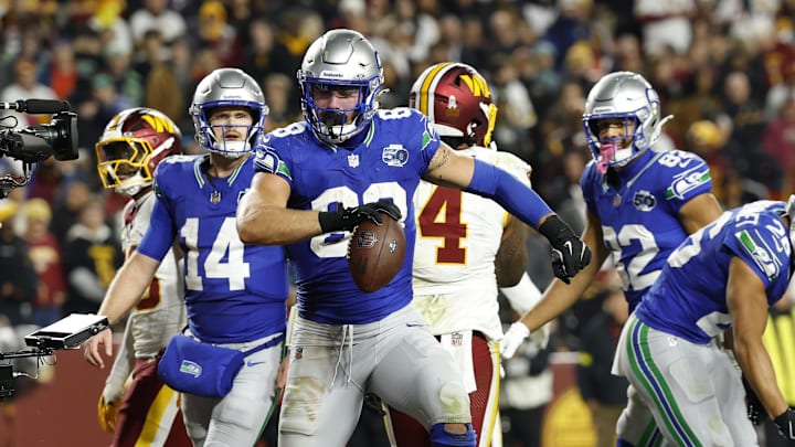 Nov 2, 2025; Landover, Maryland, USA;  Seattle Seahawks tight end AJ Barner (88) celebrates scoring a touchdown during the third quarter against the Washington Commanders at Northwest Stadium.