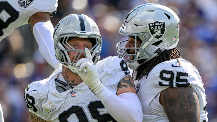 Las Vegas Raiders defensive end Maxx Crosby (98) celebrates with defensive tackle John Jenkins (95) 