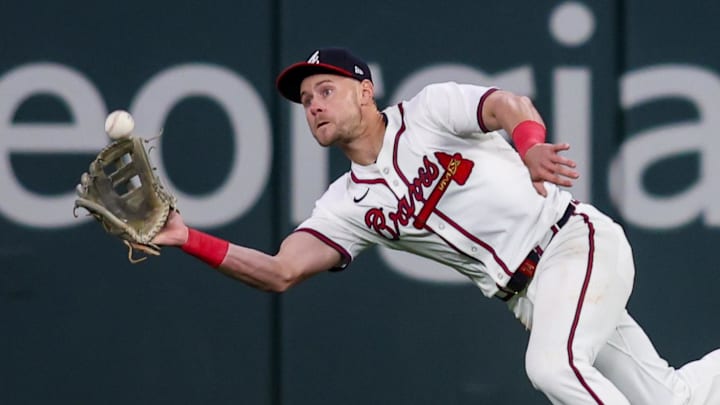 Apr 8, 2025; Atlanta, Georgia, USA; Atlanta Braves right fielder Jarred Kelenic (24) catches a fly ball against the Philadelphia Phillies in the ninth inning at Truist Park. Mandatory Credit: Brett Davis-Imagn Images