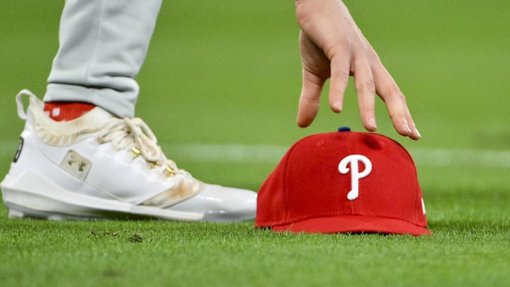 Apr 11, 2025; St. Louis, Missouri, USA; Philadelphia Phillies third baseman Alec Bohm (28) picks up his hat after chasing down a fly ball against the St. Louis Cardinals during the third inning at Busch Stadium. Mandatory Credit: Jeff Curry-Imagn Images Apr 11, 2025; St. Louis, Missouri, USA; Philadelphia Phillies third baseman Alec Bohm (28) picks up his hat after chasing down a fly ball against the St. Louis Cardinals during the third inning at Busch Stadium. Mandatory Credit: Jeff Curry-Imagn Images