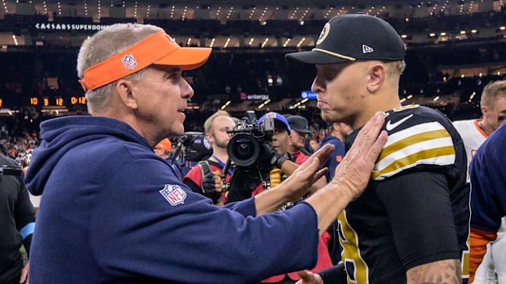 Payton greets Saints quarterback Spencer Rattler after Denver’s 33–10 win.