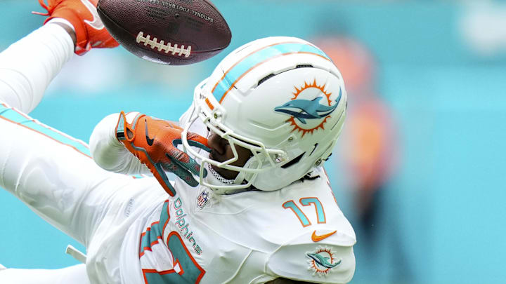 Oct 12, 2025; Miami Gardens, Florida, USA; Miami Dolphins wide receiver Jaylen Waddle (17) juggles a ctach against the Los Angeles Chargers during the second quarter at Hard Rock Stadium. Mandatory Credit: Rich Storry-Imagn Images