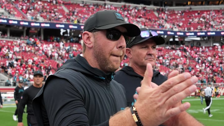 Sep 28, 2025; Santa Clara, California, USA; Jacksonville Jaguars head coach Liam Coen (center) shakes hands with San Francisco 49ers head coach Kyle Shanahan (right) after the game at Levi's Stadium. Mandatory Credit: Darren Yamashita-Imagn Images