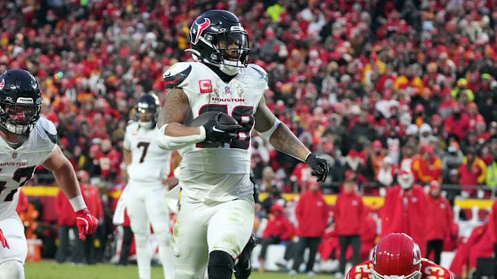 Jan 18, 2025; Kansas City, Missouri, USA; Houston Texans running back Joe Mixon (28) runs the ball in for a touchdown against Kansas City Chiefs cornerback Jaylen Watson (35) and linebacker Drue Tranquill (23) during the third quarter of a 2025 AFC divisional round game at GEHA Field at Arrowhead Stadium. Mandatory Credit: Denny Medley-Imagn Images