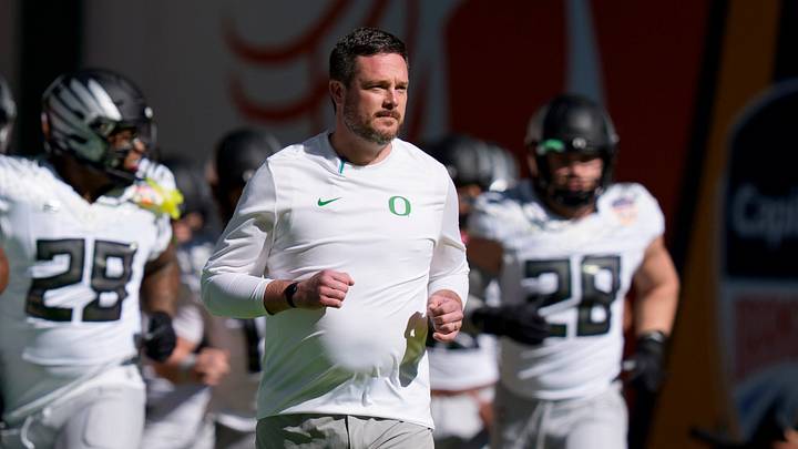 Oregon head coach Dan Lanning takes the field with his team for warmups as the Oregon Ducks take on the Texas Tech Red Raiders in the Orange Bowl on Jan. 1, 2026, at Hard Rock Stadium in Miami, Florida.