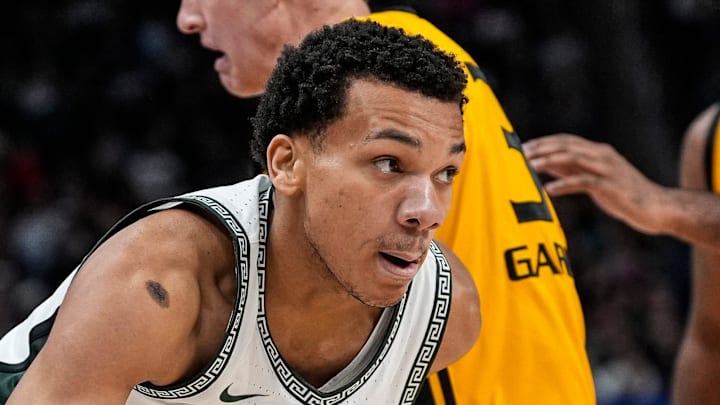 Michigan State guard Divine Ugochukwu (99) dribbles against Oakland during the second half at Little Caesars Arena in Detroit on Saturday, Dec. 20, 2025. Michigan State guard Divine Ugochukwu (99) dribbles against Oakland during the second half at Little Caesars Arena in Detroit on Saturday, Dec. 20, 2025.