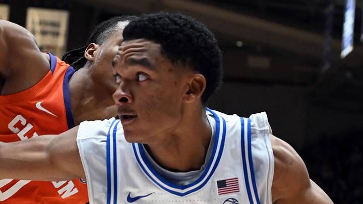 Feb 14, 2026; Durham, North Carolina, USA; Duke Blue Devils guard Caleb Foster (1) controls the ball in front of Clemson Tigers forward RJ Godfrey (0) during the second half at Cameron Indoor Stadium. Mandatory Credit: Rob Kinnan-Imagn Images