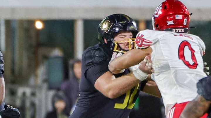 Nov 29, 2024; Orlando, Florida, USA; UCF Knights quarterback EJ Colson (12) looks to pass during the second quarter against the Utah Utes at FBC Mortgage Stadium. Mandatory Credit: Mike Watters-Imagn Images