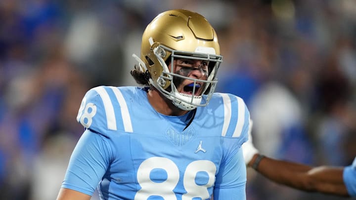 Oct 28, 2023; Pasadena, California, USA; UCLA Bruins tight end Moliki Matavao (88) celebrates after scoring on a 26-yard touchdown reception against the Colorado Buffaloes in the second half at Rose Bowl. UCLA defeated Colorado 28-16. Mandatory Credit: Kirby Lee-Imagn Images
