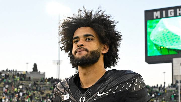 Nov 22, 2025; Eugene, Oregon, USA; Oregon Ducks quarterback Dante Moore (5) walks off the field after the game against the Southern California Trojans at Autzen Stadium. Mandatory Credit: Troy Wayrynen-Imagn Images
