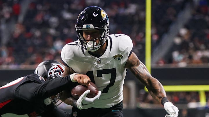 Aug 23, 2024; Atlanta, Georgia, USA; Jacksonville Jaguars tight end Evan Engram (17) is pushed out of bounds by Atlanta Falcons linebacker Bradlee Anae (47) in the second quarter at Mercedes-Benz Stadium. Mandatory Credit: Brett Davis-Imagn Images