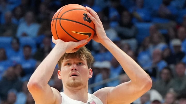 Feb 23, 2026; Chapel Hill, North Carolina, USA; North Carolina Tar Heels center Henri Veesaar (13) shoots a three point shot as Louisville Cardinals forward Vangelis Zougris (53) defends in the second half at Dean E. Smith Center. Mandatory Credit: Bob Donnan-Imagn Images Feb 23, 2026; Chapel Hill, North Carolina, USA; North Carolina Tar Heels center Henri Veesaar (13) shoots a three point shot as Louisville Cardinals forward Vangelis Zougris (53) defends in the second half at Dean E. Smith Center. Mandatory Credit: Bob Donnan-Imagn Images