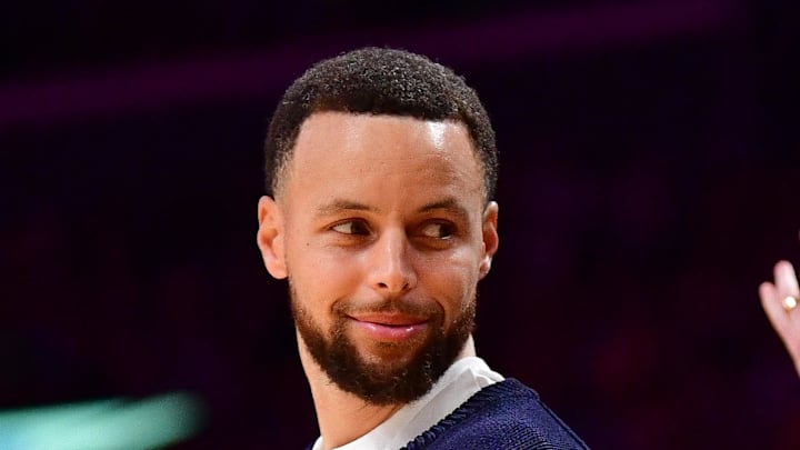 Golden State Warriors guard Stephen Curry watches game action against the Los Angeles Lakers.