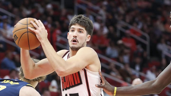 Nov 20, 2024; Houston, Texas, USA; Houston Rockets guard Reed Sheppard (15) attempts to drive with the ball past Indiana Pacers forward Johnny Furphy (12) during the second quarter at Toyota Center. Mandatory Credit: Troy Taormina-Imagn Images