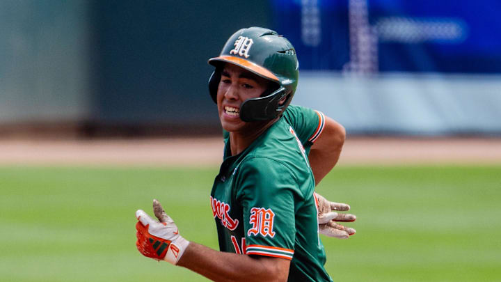May 23, 2024; Charlotte, NC, USA; Miami (Fl) Hurricanes infielder Daniel Cuvet (14) heads to third against the Clemson Tigers in the second inning during the ACC Baseball Tournament at Truist Field. Mandatory Credit: Scott Kinser-Imagn Images