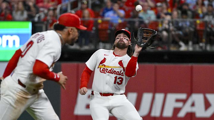 Jun 5, 2025; St. Louis, Missouri, USA;  St. Louis Cardinals right fielder Ryan Vilade (13) catches a fly ball in foul territory against the Kansas City Royals during the sixth inning at Busch Stadium. Mandatory Credit: Jeff Curry-Imagn Images