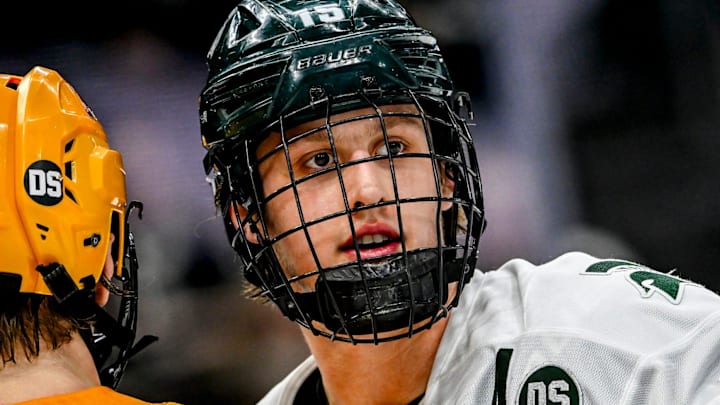 Michigan State and Minnesota wear 'DS' patches in honor of the late hockey staffer Dan Sturges during the third period in the game against on Friday, Jan. 23, 2026, at Munn Ice Arena in East Lansing. Pictured is MSU's Charlie Stramel, right, and Beckett Hendrickson.
