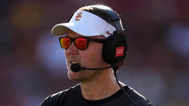 Aug 30, 2025; Los Angeles, California, USA; Southern California Trojans head coach Lincoln Riley watches from the sidelines against the Missouri State Bears in the first half at United Airlines Field at Los Angeles Memorial Coliseum. Mandatory Credit: Kirby Lee-Imagn Images
