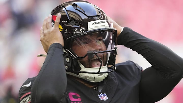 Arizona Cardinals quarterback Kyler Murray adjusts his helmet before playing against the Seattle Seahawks at State Farm Stadium in Glendale on Dec. 8, 2024.
