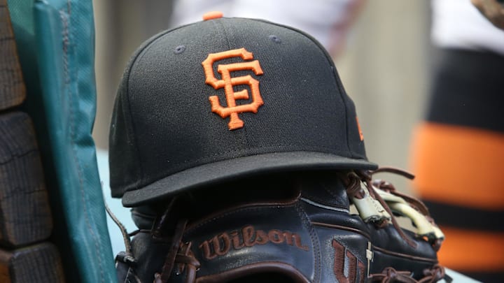 Jul 14, 2023; Pittsburgh, Pennsylvania, USA;  San Francisco Giants hat and glove on the bench against the Pittsburgh Pirates during the first inning at PNC Park. 