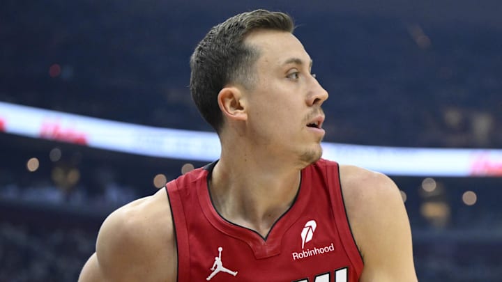 Apr 20, 2025; Cleveland, Ohio, USA; Miami Heat forward Duncan Robinson (55) looks to pass beside Cleveland Cavaliers guard Ty Jerome (2) in the first quarter at Rocket Arena. Mandatory Credit: David Richard-Imagn Images