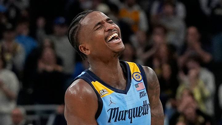 Marquette Golden Eagles guard Kam Jones (1) assists and reacts to the dunk from Marquette Golden Eagles forward Damarius Owens (10) during the second half of the game against Providence on Tuesday, February 25, 2025, at Fiserv Forum in Milwaukee, Wis.