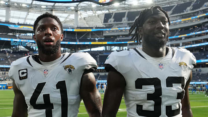 Sep 25, 2022; Inglewood, California, USA; Jacksonville Jaguars linebacker Josh Allen (41) and linebacker Devin Lloyd (33) walk off the field after the game against the Los Angeles Chargers at SoFi Stadium. Mandatory Credit: Kirby Lee-Imagn Images